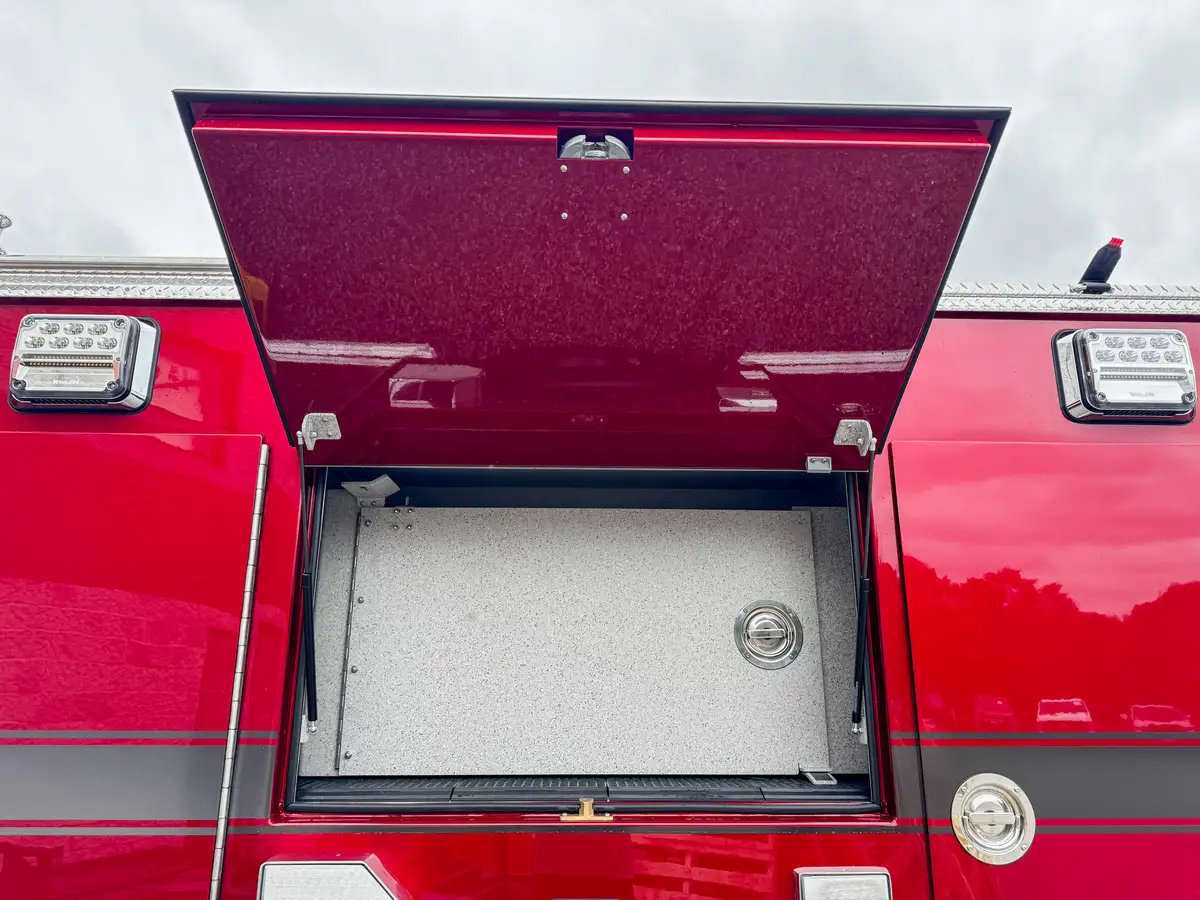 Rear compartment interior close-up with shelf and textured compartment walls.